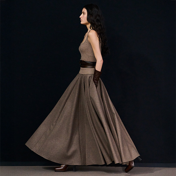 Max Mara Fall/Winter 2025 Fashion Show - Model with Hazelnut Brown Look with Top, Belt, Long Gloves and Wide Skirt.